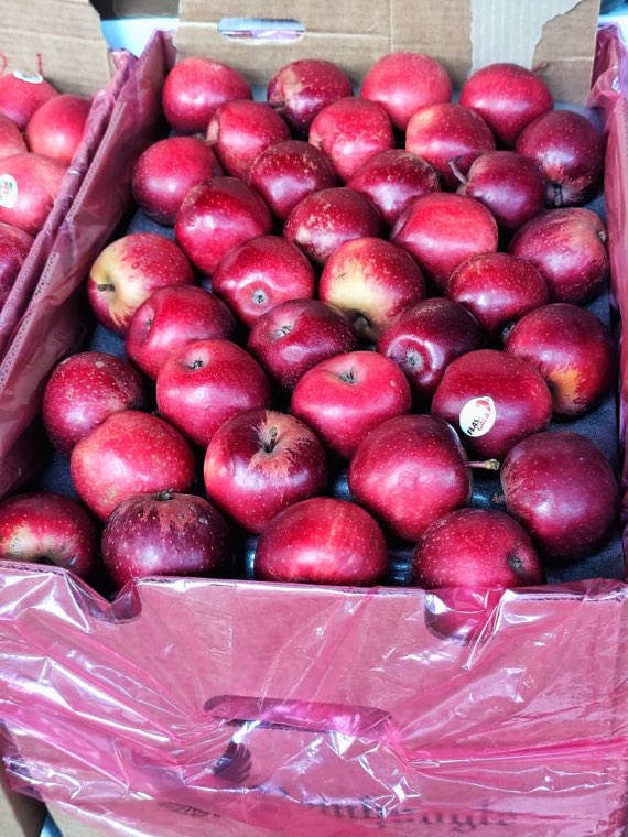 A box of red apples